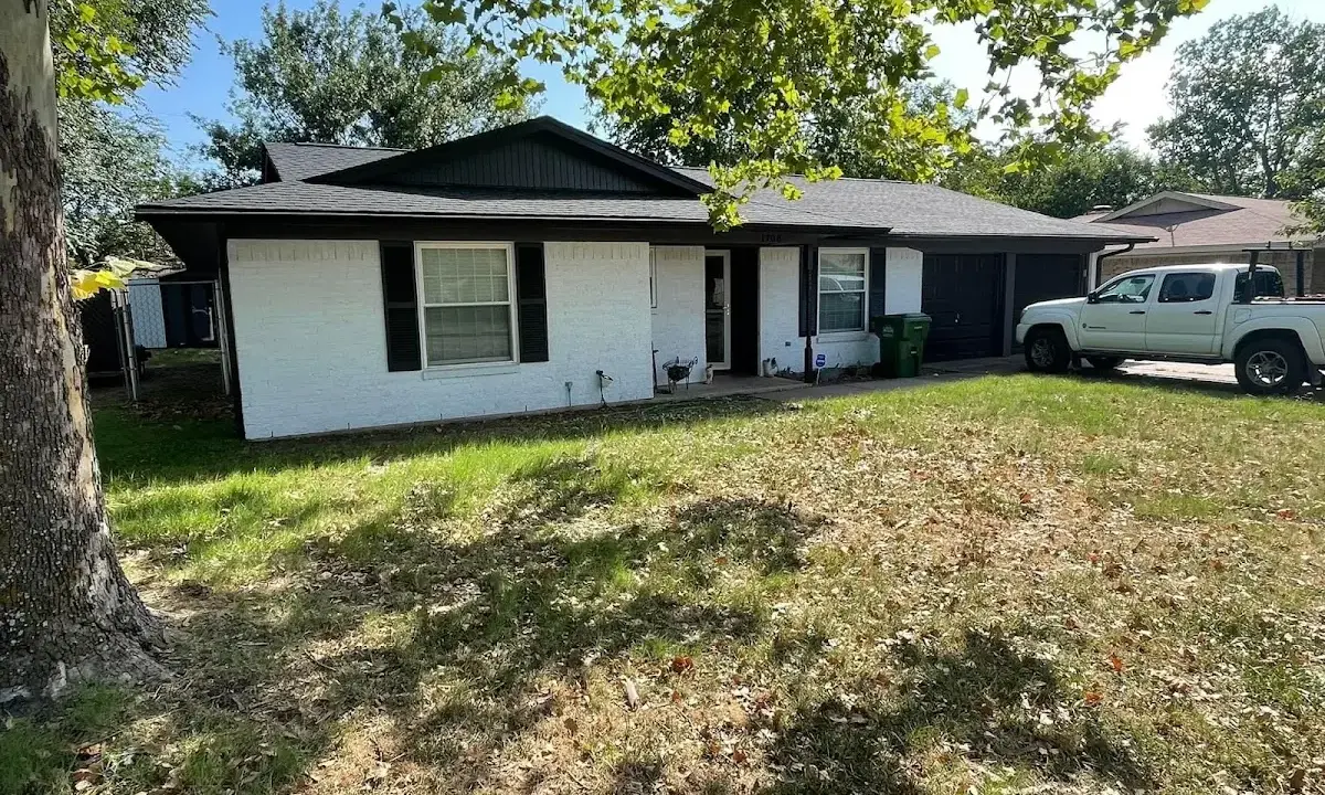 Professional roofing crew working on a residential roof in Springtown